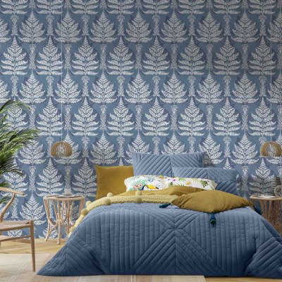 The bedroom in Ferndale features a blue and white leafy patterned wallpaper. Key elements: **blue and white**, **leafy patterns**.