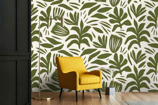 The wallpaper features a bold, leafy green pattern set against a crisp white background, evoking the lush landscapes of Amalfi Italy. The intricate foliage design incorporates various shades of green to create depth and texture, making it a standout element in the room.