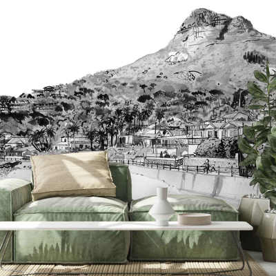 The wallpaper in the modern living room features a black-and-white mural depicting a hilly landscape with houses and trees. Key elements include rolling hills, quaint houses, and detailed tree patterns. The entire scene is rendered in monochromatic tones, emphasizing contrasts between light and dark to create depth and texture.