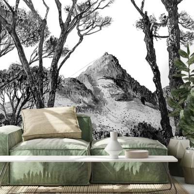 Black and white mural features tree silhouettes and a mountain landscape.