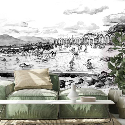 Monochrome mural featuring a busy beach scene with people, beach huts, and rocky terrain under a partly cloudy sky.