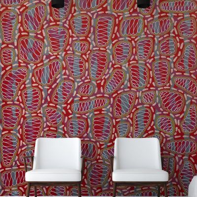 Vibrant red wall, abstract multicolored shapes, dynamic patterns.