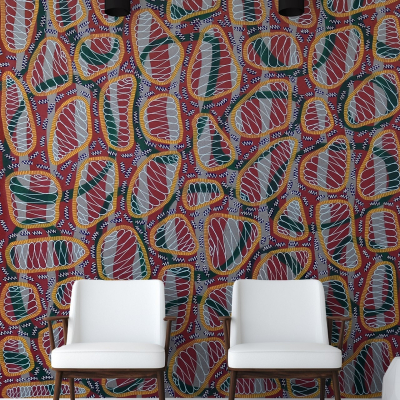 Abstract patterned wallpaper with red, green, yellow, and white shapes.