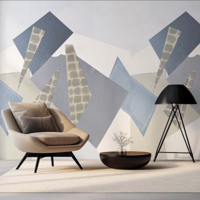 The wallpaper in the living room features a geometric mural with shades of blue, gray, and beige. It consists of various shapes creating a modern design that adds depth and interest to the wall.