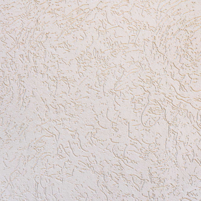 A beige textured wall with a roughed-up, stucco-like surface features random, slightly raised patterns creating an abstract design. Subtle variations in shading add depth to the texture. Keywords: beige, textured wall, roughed-up surface, stucco-like, raised patterns, abstract design, shading variations.