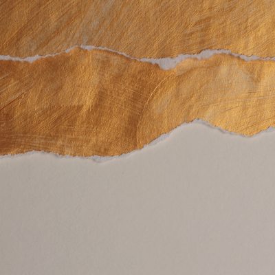 Gold leaf texture, torn paper, white background, rough textured gold surface, metallic sheen, smooth white paper contrast.