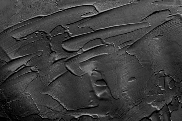 Textured black wallpaper with abstract, irregular patterns; brush strokes and grooves; artist's canvas style; rugged dynamic effect. Elements: black, gray hues, textured surface, irregular lines.