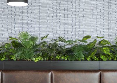 Wavy-patterned wall, featuring fluid, undulating lines with shades of gray.