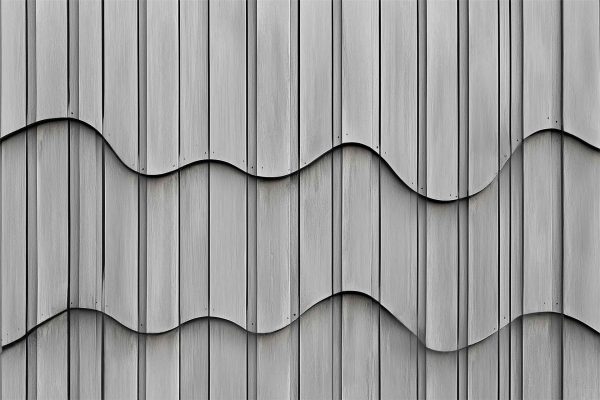 Gray metal wall, abstract design, three horizontal wavy lines, overlapping panels, smooth texture, rhythmic pattern, soft hue of red accents.