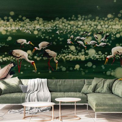 Wall mural featuring messenger birds—storks with red legs and white feathers against a dark green, dotted backdrop.