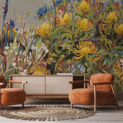 The wallpaper features a vibrant floral mural with large yellow Chinkerinchee flowers, green leaves, and splashes of pink and blue accents. The design is bold, colorful, botanical, and showcases oversized flower motifs.