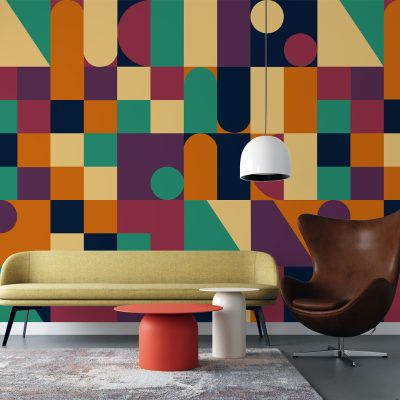 The wallpaper features a geometric pattern with colorful shapes like triangles, circles, and squares. Dominant colors include blue, yellow, pink, and green.