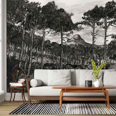 The wallpaper is a large black-and-white mural depicting a forest with tall trees in the foreground and layered mountains in the background. The design uses grayscale tones, featuring detailed tree silhouettes and misty mountain outlines, creating a dramatic monochrome landscape scene.