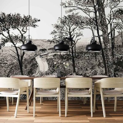 Black and white wall mural featuring a forest landscape. The wallpaper shows tall, slender trees with detailed branches and trunks in varying shades of gray. A winding road or path curves through the scene, creating depth. The overall palette is monochrome, using blacks, whites, and grays to depict the natural scenery and evoke a serene woodland atmosphere.