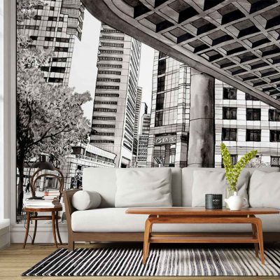 The wallpaper is a large black-and-white mural depicting urban skyscrapers and detailed city architecture. Elements include high-rise buildings, classic facades, arched windows, and intricate detailing that evoke an Old Town House charm. Monochrome tones of black, white, and gray dominate the mural’s color palette.