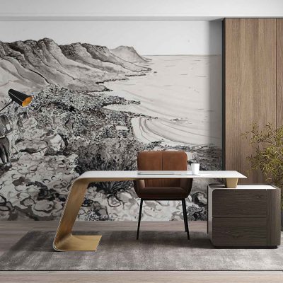 Wall mural wallpaper: Features a detailed rocky coastline with dramatic cliffs, serene blue water, and distant mountains in muted grey-blues. Central to the scene is a solitary figure standing near an old stone facade perched on the cliff’s edge. Earthy tones—warm browns, cool greys, deep green foliage—blend with soft sky gradients for a tranquil yet majestic landscape.