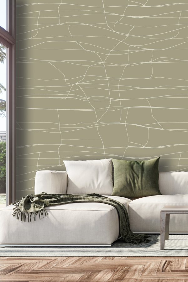 Wallpaper features a light olive green background with delicate, abstract white lines inspired by intricate saree patterns. The design is subtle and airy, giving a modern yet traditional touch. Pattern emphasizes fine, flowing linear motifs over a soft olive base.
