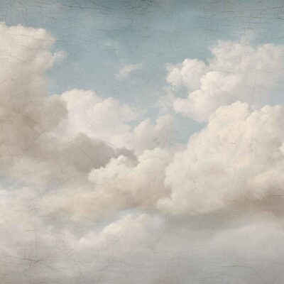 Wallpaper features fluffy white Maestro Clouds scattered across a light blue sky. Subtle cracks and textured patterns give it an aged, vintage look. Main colors: white, soft blue, hints of beige or gray in the textured areas. Elements: clouds, sky, crackle effect, vintage texture.